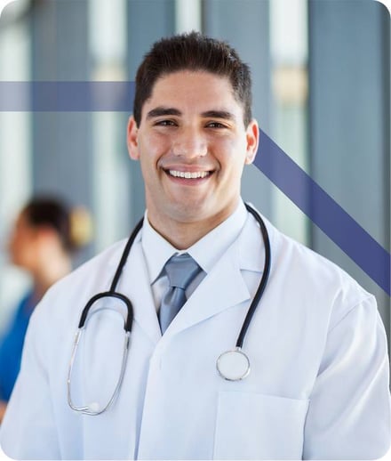 doctor smiling in hospital hallway