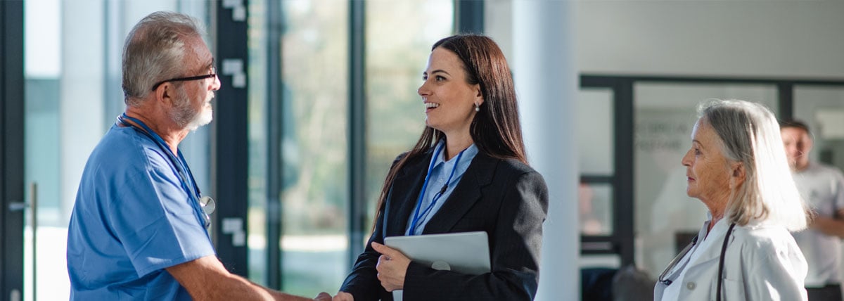 doctor and consultant shaking hands