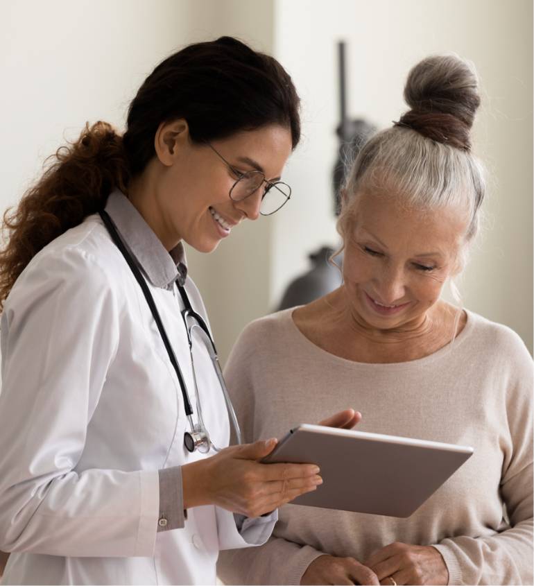 doctor and patient looking at tablet